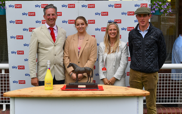 Mark, Charlotte and Clare Oglesby from Goldsborough Hall presenting the Byerley Turk trophy for the leading trainer award 