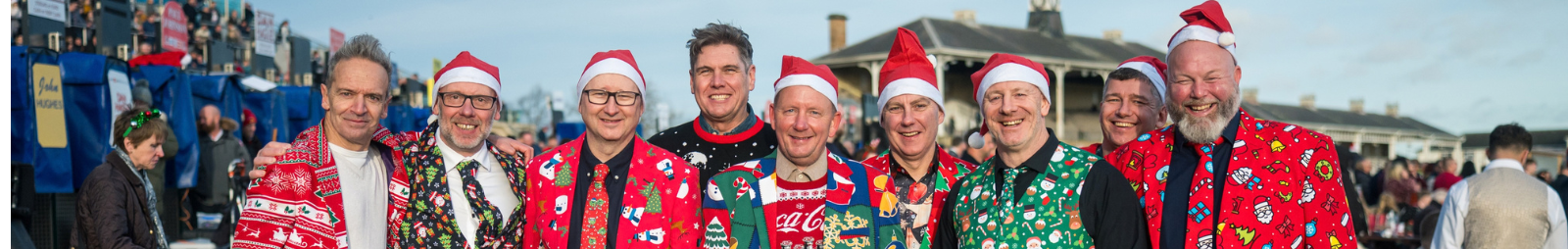 Group of men at Doncaster Racecourse in Christmas Jumpers