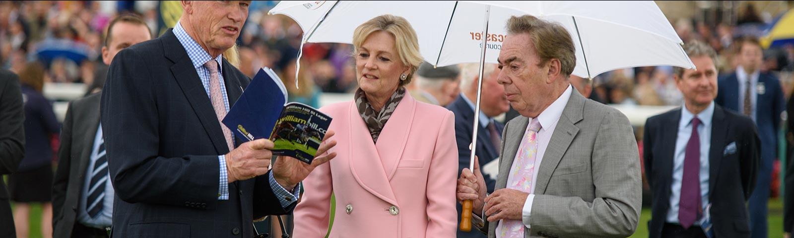 Couple of racegoers at the races at Doncaster Racecourse.