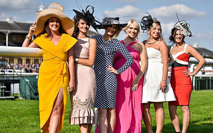 Group of women smile and pose for the camera