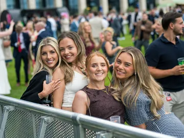 Group of young girls smiling at Doncaster Racecourse
