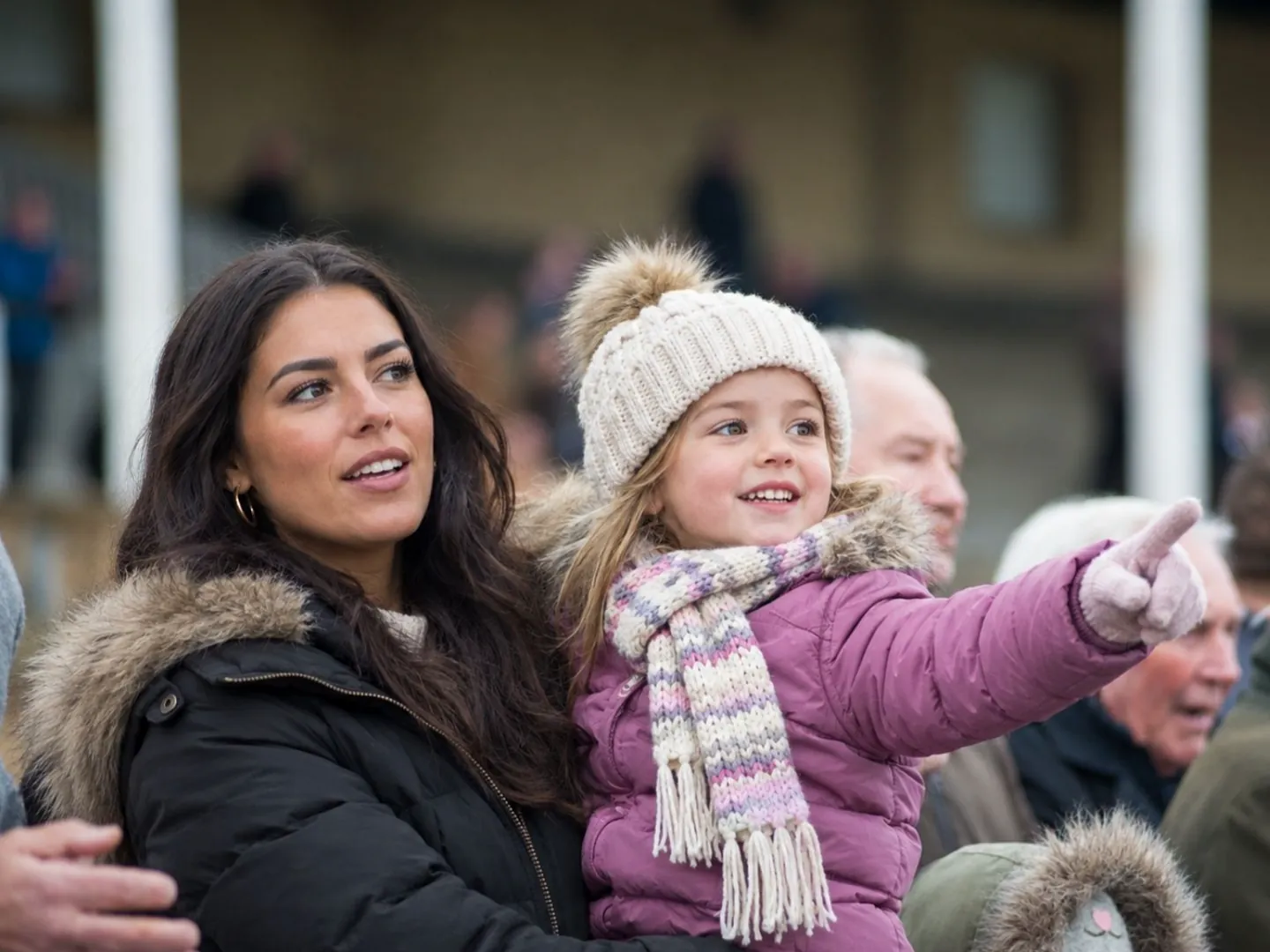 Mother and daughter watching the racing on Winter Family Funday