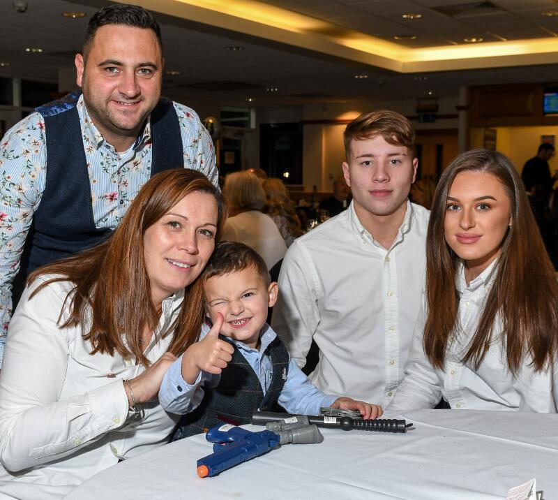 A family enjoying hospitality at a fireworks event.