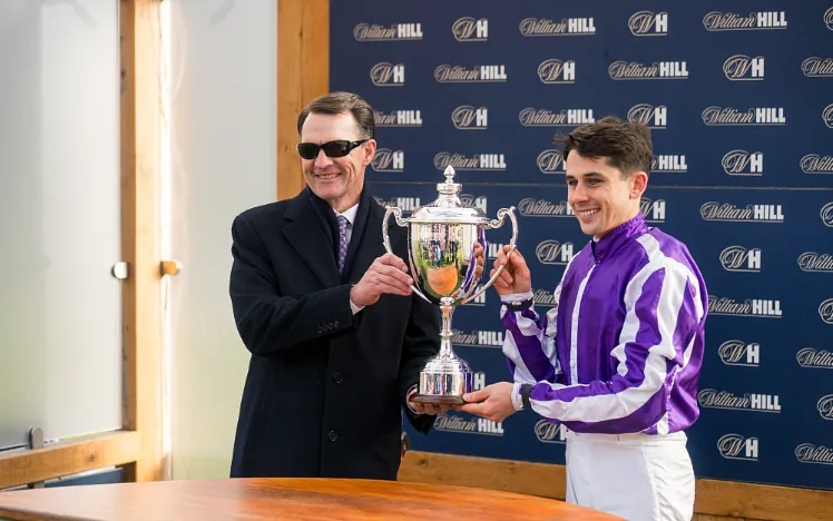 Aidan O'Brien and winning Futurity jockey lifting the trophy at Doncaster Racecourse