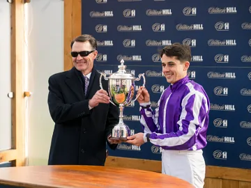 Aidan O'Brien and winning Futurity jockey lifting the trophy at Doncaster Racecourse
