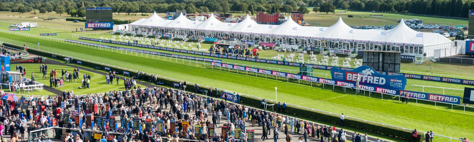 Doncaster Racecourse Grandstand Enclosure crowd and Marquee