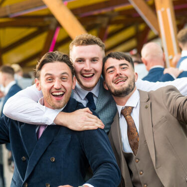 Group of 3 lads partying in the party barn on Betfred St Leger Day