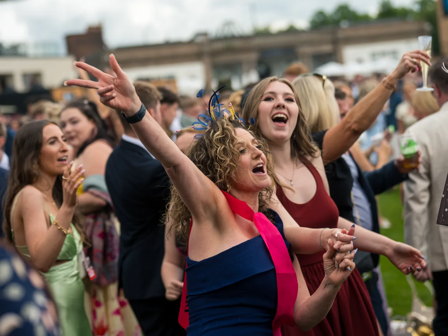 Women singing at Doncaster Races