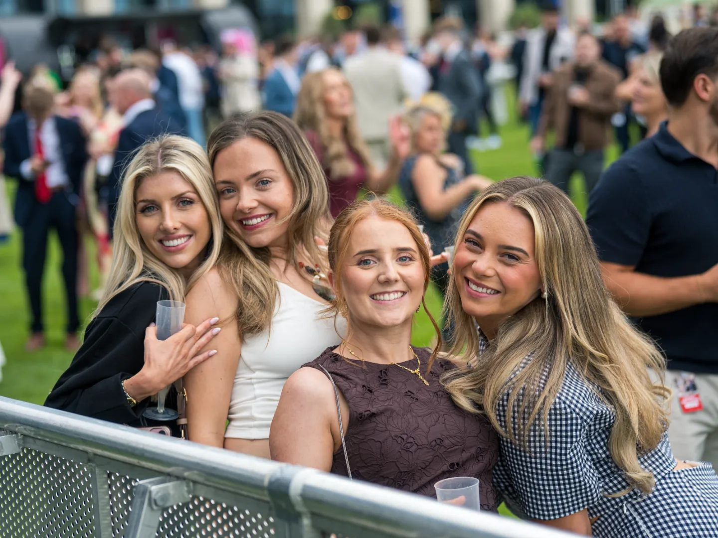 Group of women smiling at Doncaster Racecourse