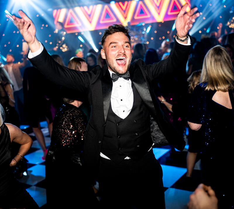 A man in a tuxedo dancing on the dancefloor at the Christmas Live event in Doncaster 