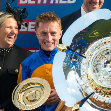 Tom Marquand celebrating after winning the 2025 Betfred St Leger Stakes