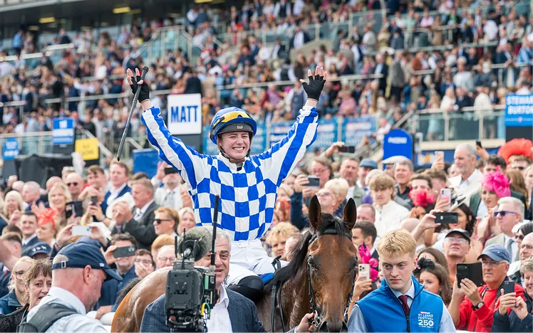 Saffie Osborne celebrating after winning the St Leger Stakes on Highwayman