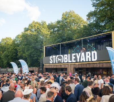 Stobleyard stand with crowds in front