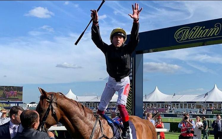 Frankie Dettori celebrates as he crosses the finish line.