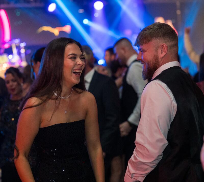 Two people and laughing at a party 