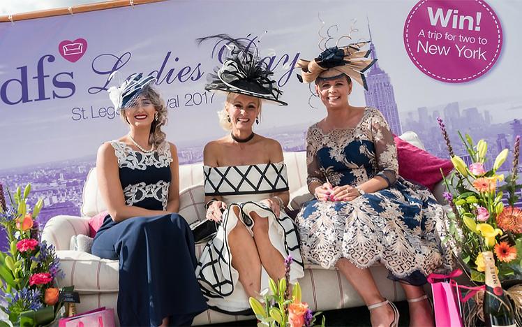 Three women pose for the DFS best dressed